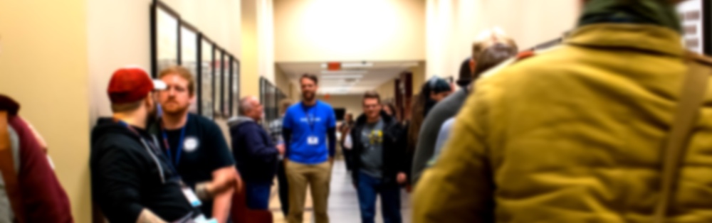 A few groups of PyTN 2019 attendees talking while attending the Hallway Track.